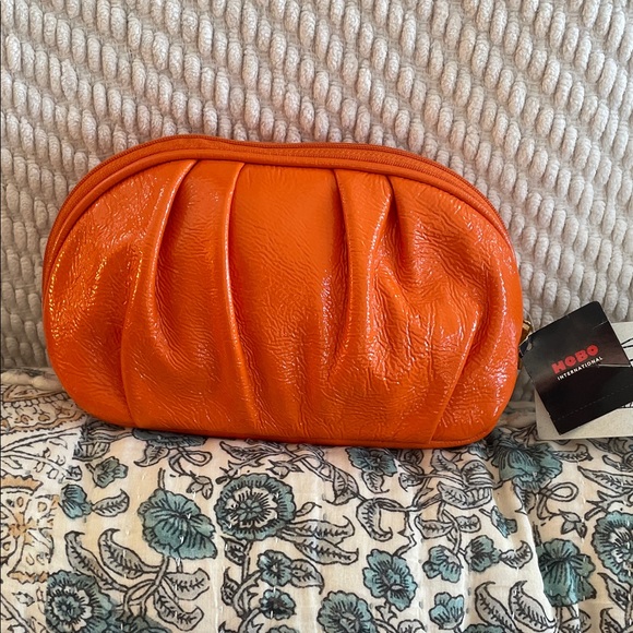 HOBO Handbags - NWT $65 HOBO International Vibrant Patent Orange Clutch Makeup Accessories